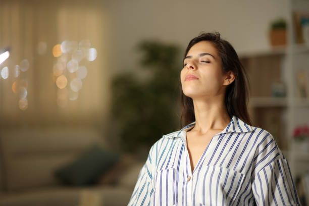 Satisfied woman breathing at home in the night hypnose Lyon 3